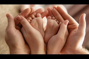 Baby feet in parent hands