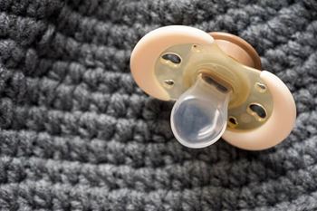 closeup new yellow baby pacifier