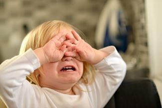 Portrait of crying baby girl