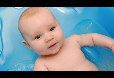 Three months old baby in bath