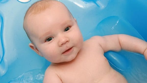 Three months old baby in bath