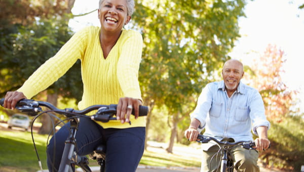 Senior Couple On Cycle Ride In Countryside