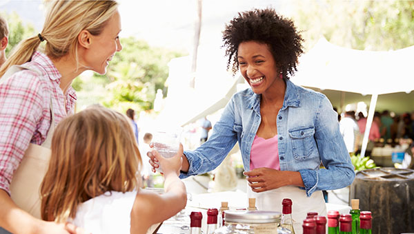 farmers market vendor with customer