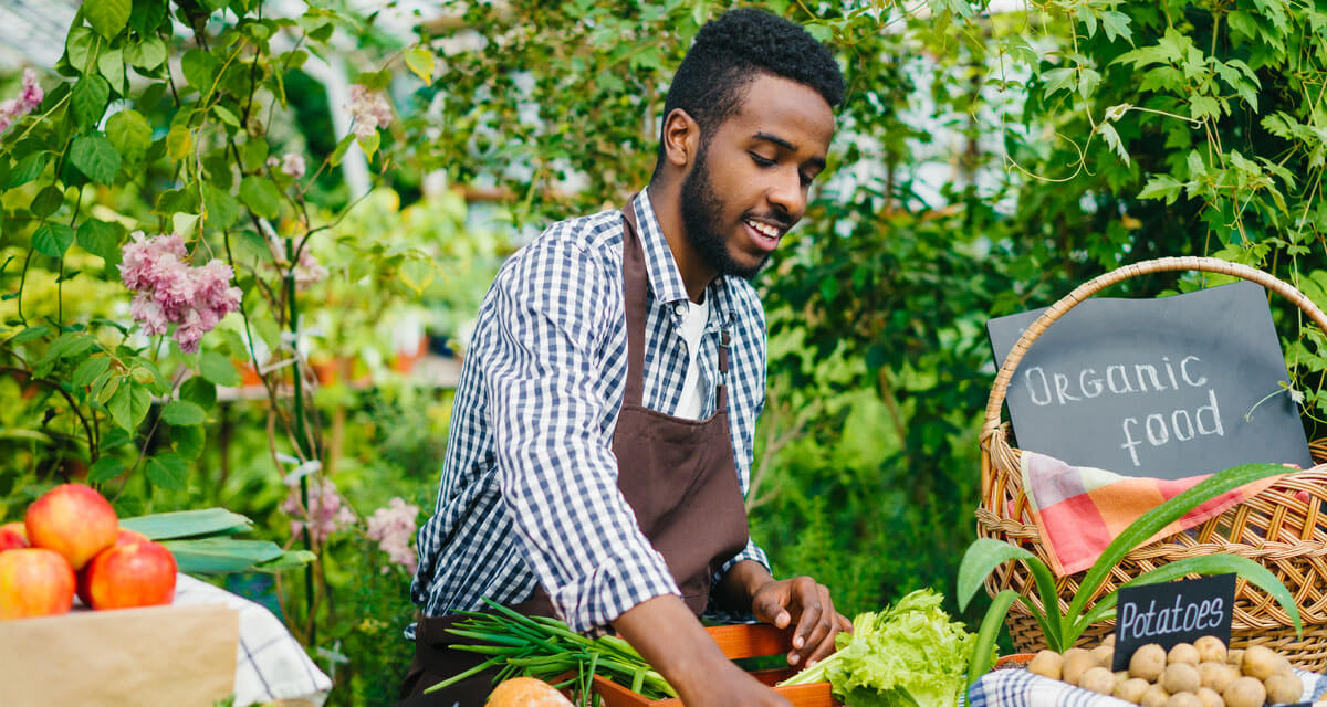 man selling product farmers market