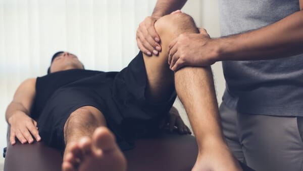 Medical professional providing a sports medicine consultation