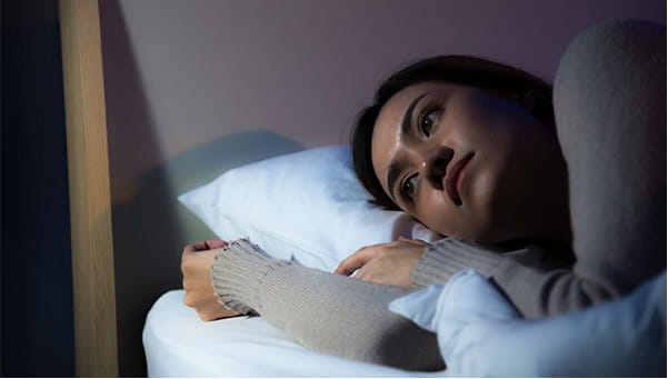 woman awake in bed