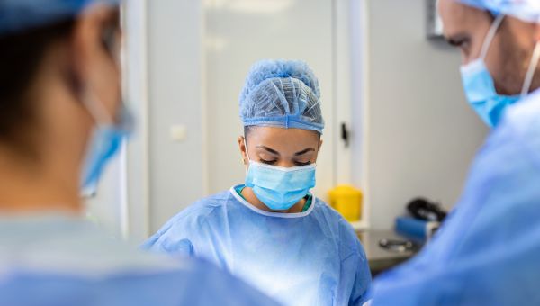 A group of surgeons in an operating room