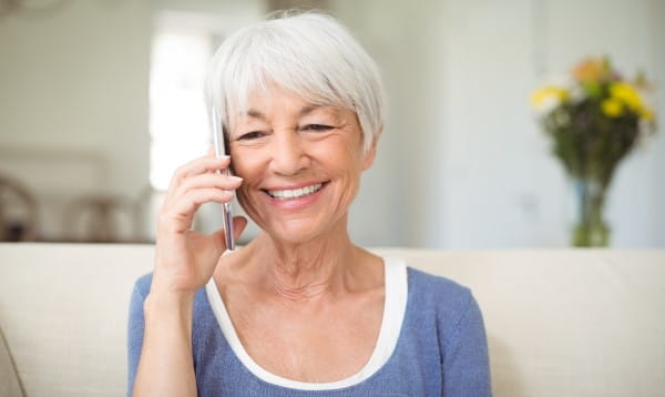Lady smiling while talking on the phone