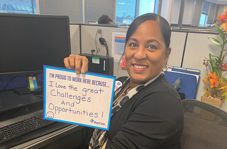 BayCare team member holding testimonial sign
