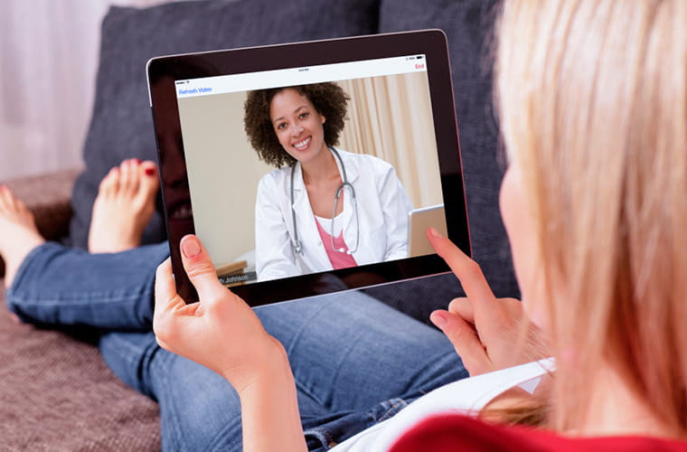 woman having a telemedicine visit on an ipad