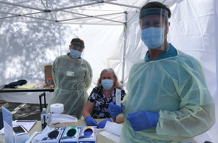 Dr. Steven Lay and others at the testing center