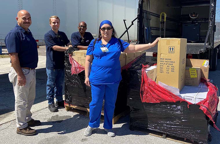 Laura with BayCare Materials Management and Harbor Freight employees during PPE pickup