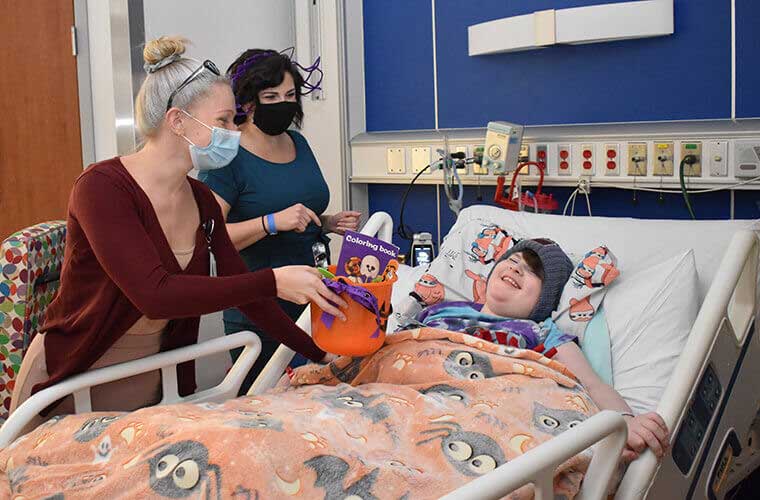 St. Joseph's Children's Hospital health care workers trick o treating with patients in the hospital