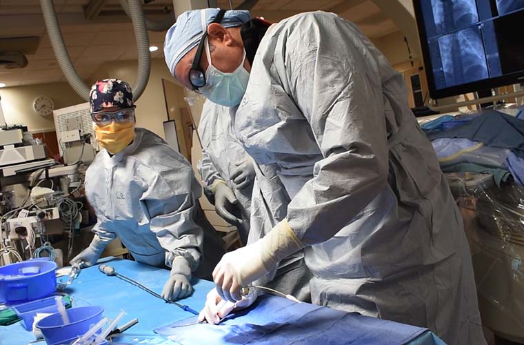 Jennifer Carter, DNP, APRN, CPNP-AC, and Dr. Jeremy Ringewald, pediatric cardiologist and the director of the Cardiac Cath Lab at St. Joseph's Children's Hospital, prepare to implant breakthrough Harmony Transcatheter Pulmonary Valve in St. Joseph’s Cardiac Catheterization Laboratory.