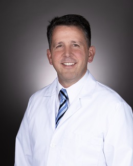A headshot photo of Adam Hulliet, MD.