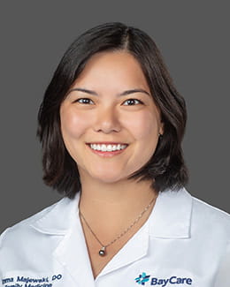 Dr. Emma Majewski's headshot wearing a lab coat 