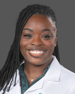 Dr. Ciandra Franklin wearing a lab coat 