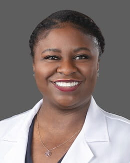 Dr. Jennifer Jeboda's headshot wearing a lab coat 