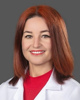 Dr. Tetyana Shvets's headshot wearing a lab coat 