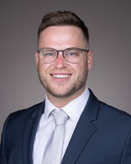 A headshot photo of Trevor Vrona.