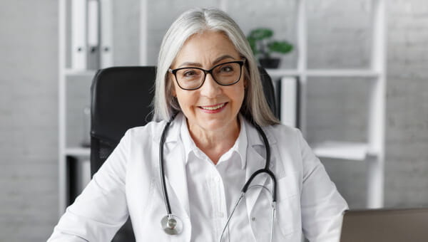 woman doctor smiling with labcoat