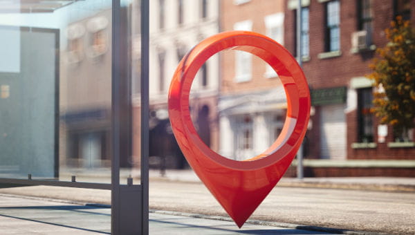 A large location icon in a city setting