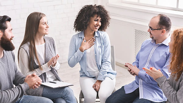Four people in group support meeting.