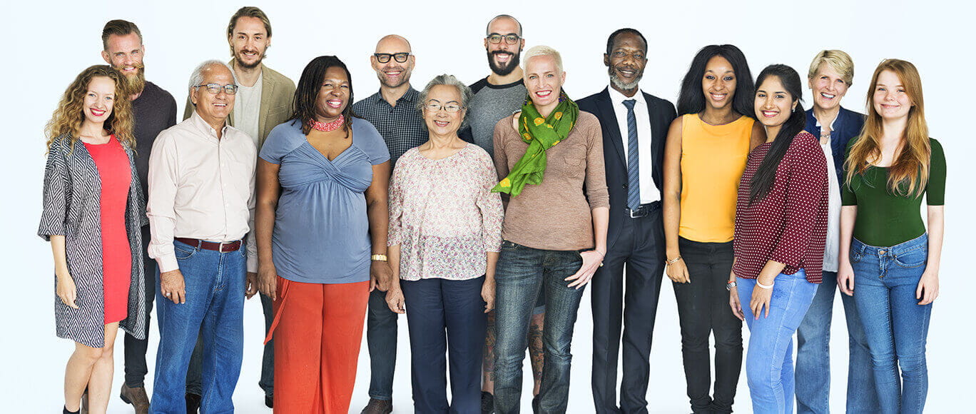 A diverse group of people poses for a group photo.