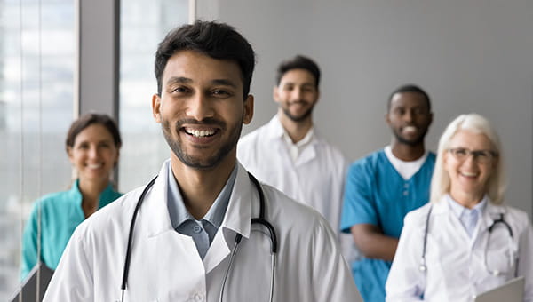 Group of doctors smiling at the camera.