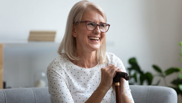 a woman sitting on the couch smiling