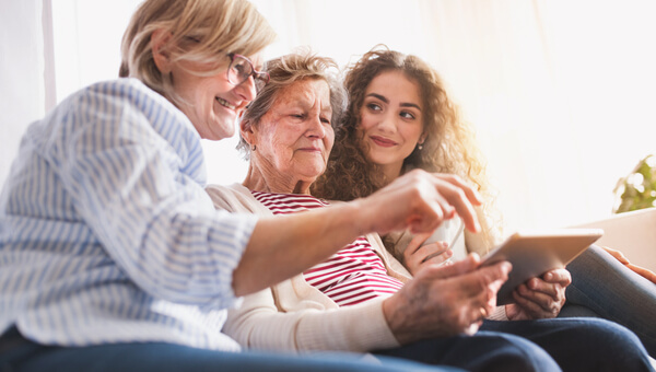 three women sitting on the couch together