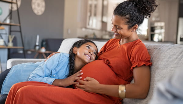 Nurse with new parents and a newborn