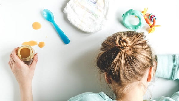 lifestyle tired mother top view on white background